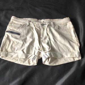 Roxy mid rise  beige denim shorts. Navy accent zipper and stitching